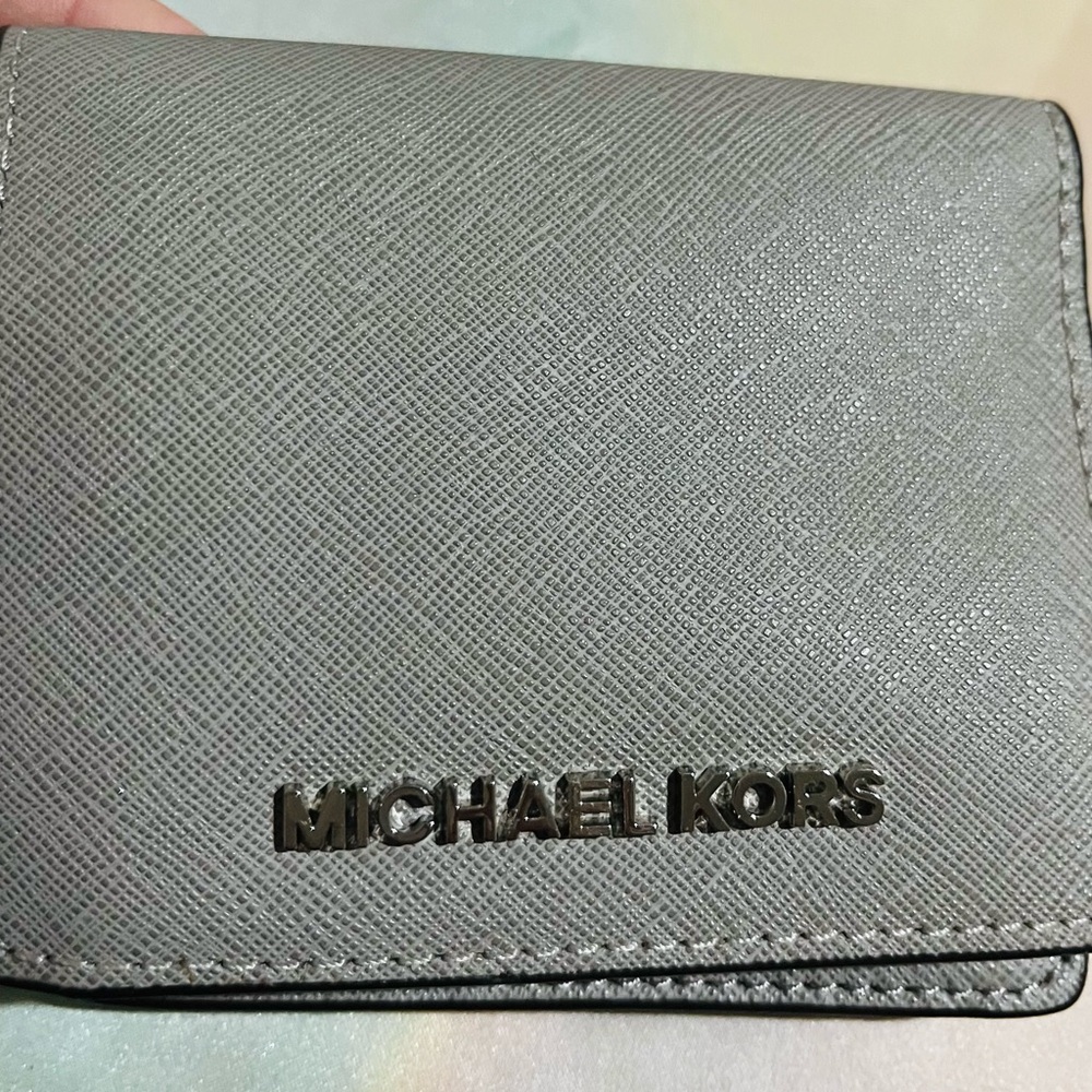 Michael Kors small grey folding wallet.